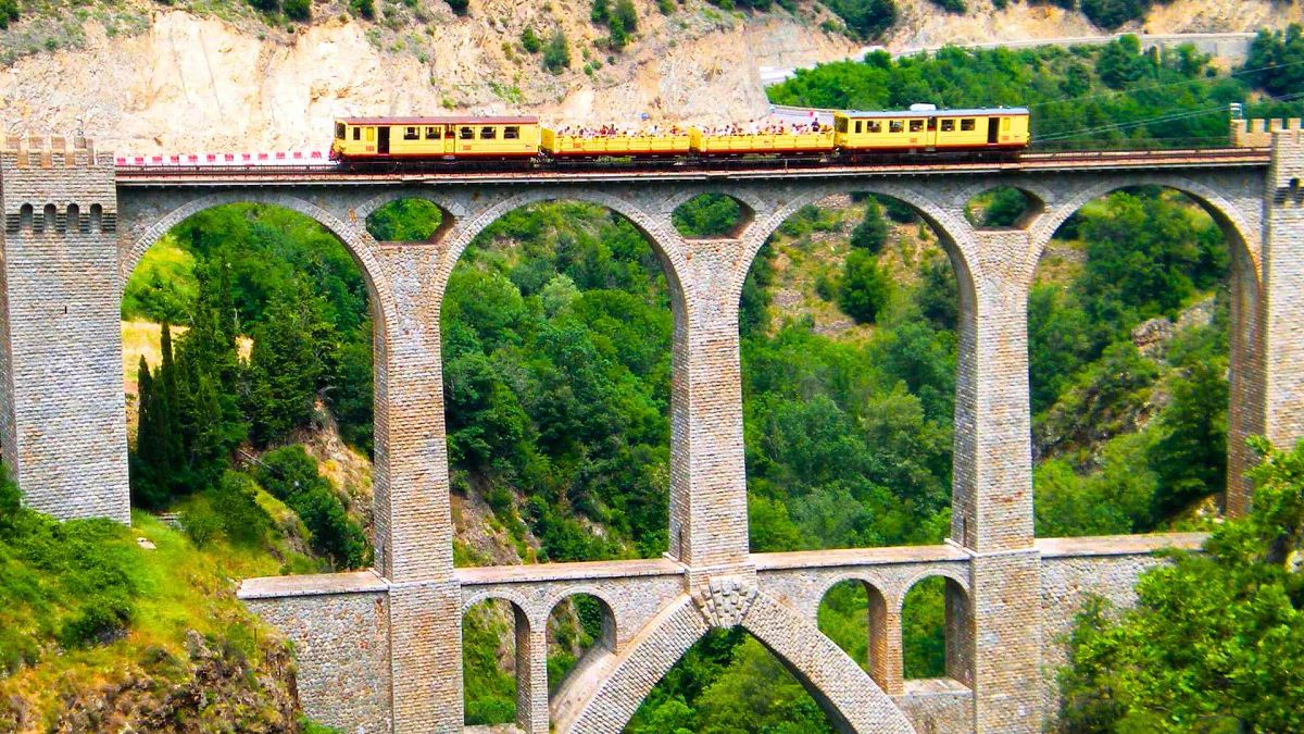 Running between Villefranche-de-Conflent and Latour-de-Carol in the Catalan region, France’s Le Petit Train Jaune offers a Wes Anderson style journey