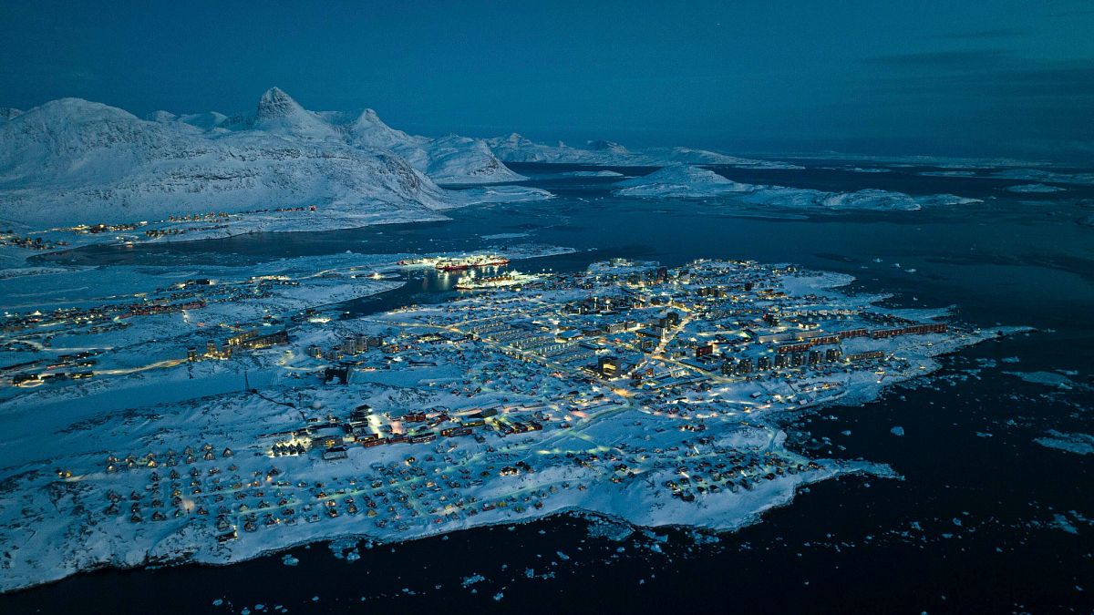 Houses covered by snow on the coast of a sea inlet in Nuuk, 7 March, 2025