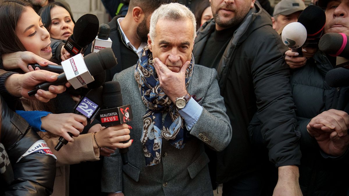 FILE: Calin Georgescu gestures as he leaves a district court in Bucharest, 5 March 2025