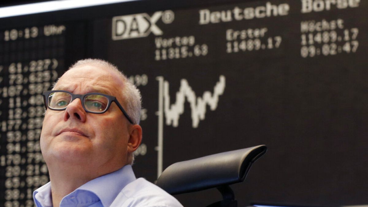 A trader watches his screens at the stock market in Frankfurt, Germany, Monday, July 13, 2015.