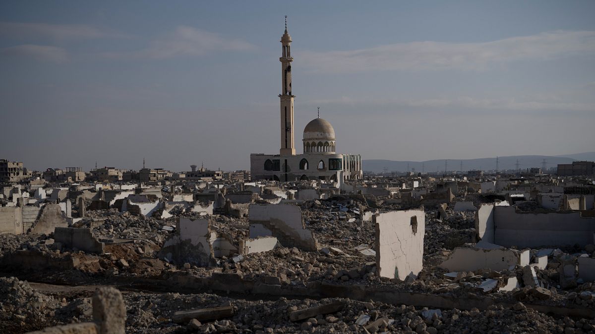 A heavily damaged mosque stands next to buildings that were completely destroyed during the civil war in Damascus, 6 January, 2025
