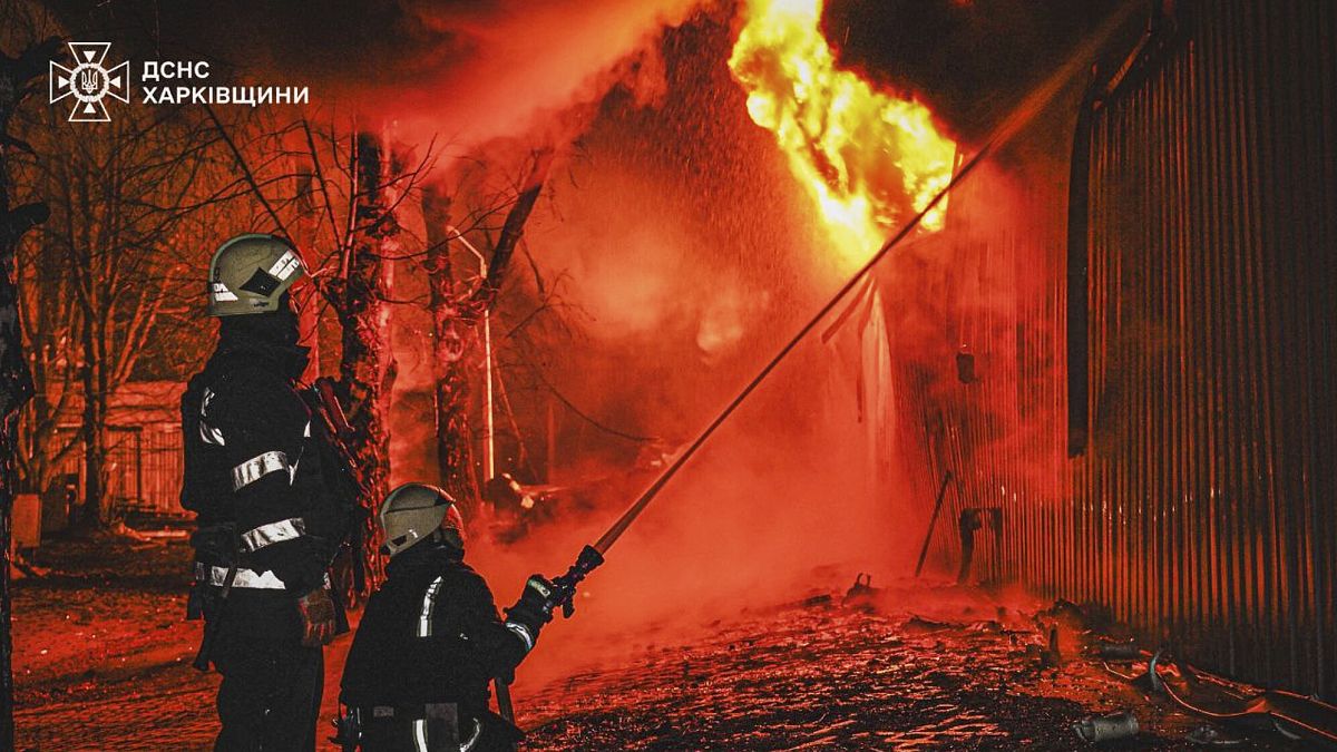 Firefighters put out the fire following a Russian attack in Kharkiv, 27 March, 2025
