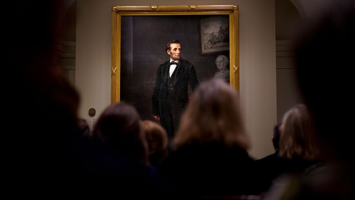 People gather for a ribbon cutting ceremony at the Smithsonian