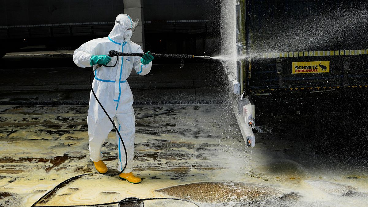 A firefighter sprays a truck with disinfectant to prevent the spread of foot-and-mouth disease from Slovakia into the Czech Republic, 11 April, 2025