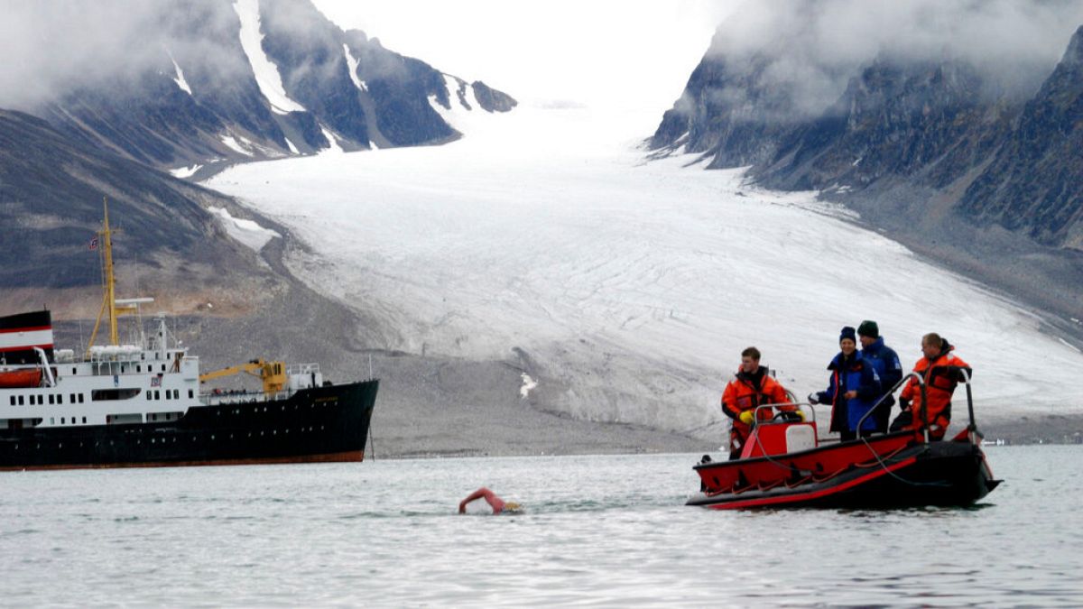 FILE - British long distance swimmer Lewis Gordon Pugh in action in the cold water off the arctic archipelogo Svalbard, Friday, Aug. 19, 2005.