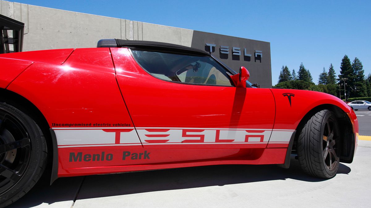File photo - A Tesla electric sport car is on display outside the showroom in Menlo Park, Calif.