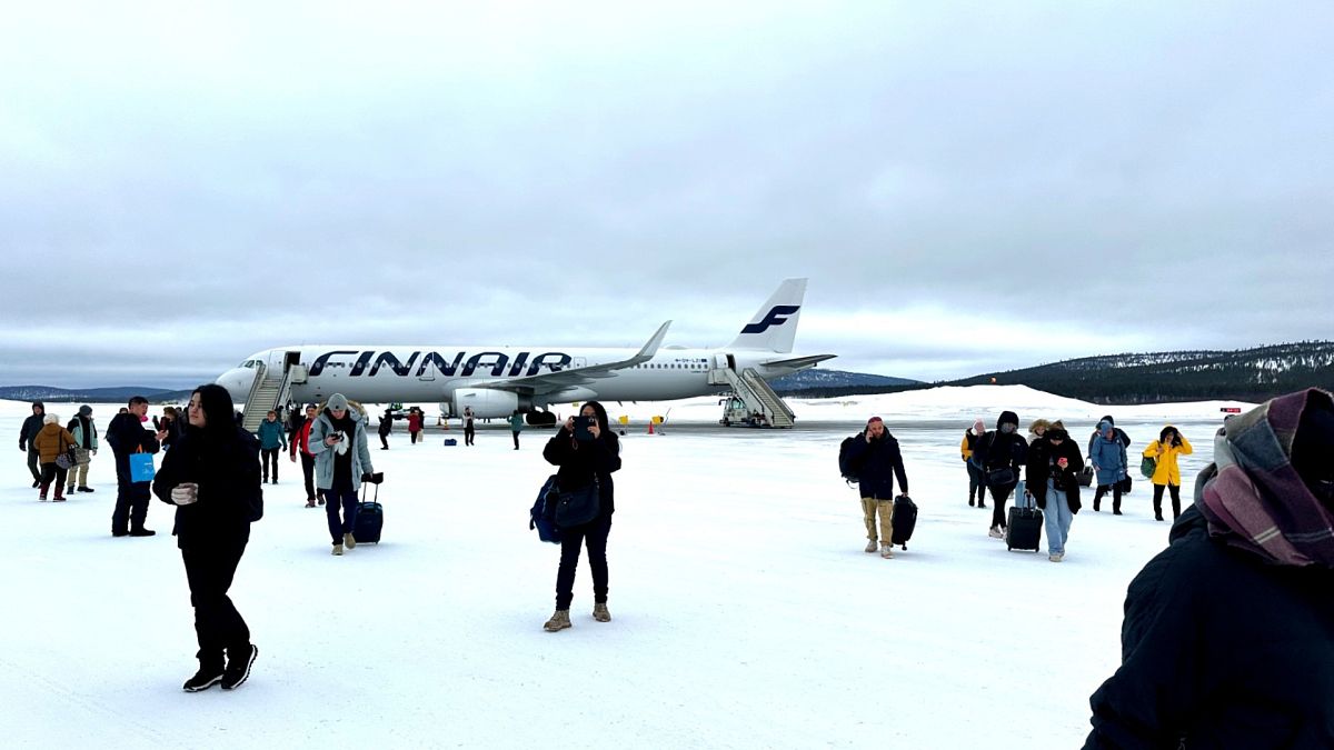 Arrivals at Ivalo Airport disembark right on the apron, with snow crunching underfoot as they make their way to the terminal.