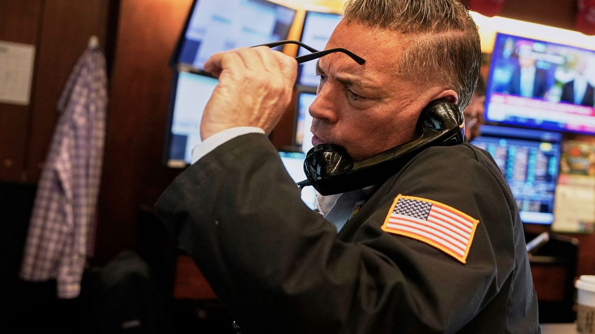 Trader Jonathan Mueller works on the floor of the New York Stock Exchange, Thursday, April 10, 2025.