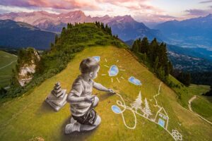 Ein Kinderspiel: Die riesigen vergänglichen Fresken des französischen Künstlers Saype erobern das Schweizer Alpenresort